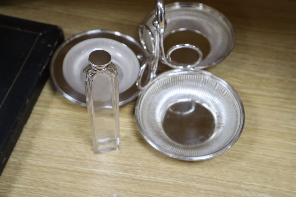 A cast and embossed silver plated teapot and matching milk jug, three plated card trays, etc.
